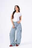 Woman wearing light blue cargo pants and a white t-shirt on a white background