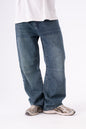 Blue jeans worn by a person on a white background